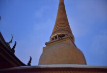 Homeless Man Addresses Soldiers From Atop Chedi