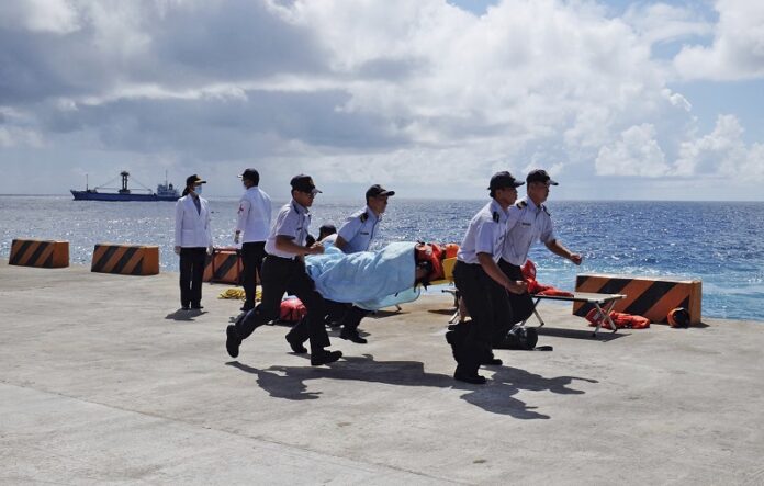 Taiwanese Coast Guard carry a mock victim during a search-and-rescue exercise Tuesday on Taiping island in the South China Sea. Photo: Johnson Lai / Associated Press