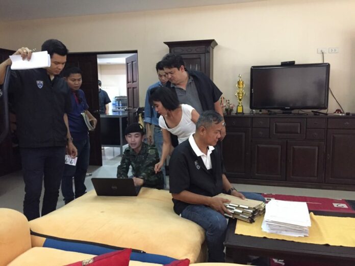 Officials search the home of German loan shark Wolfdieter Werner Mueller on Thursday afternoon in Nong Khai province.