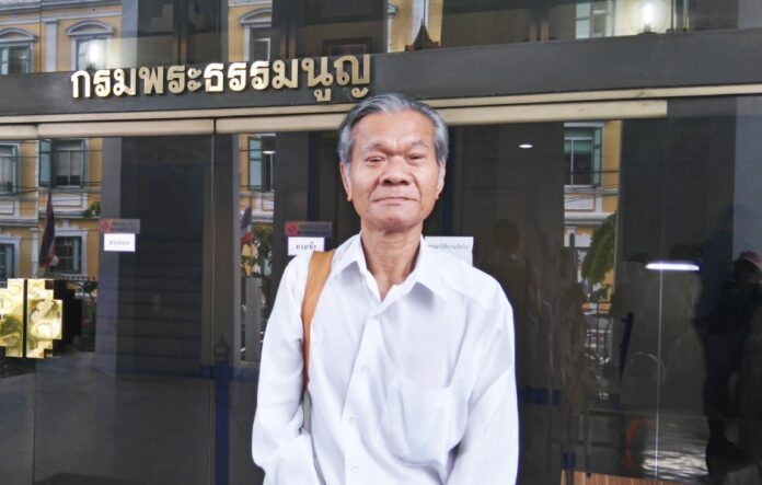 Juaseng Kow, aka Small Bundit Aneeya, poses in front of the military court in May. Image: Thai Lawyers for Human Rights