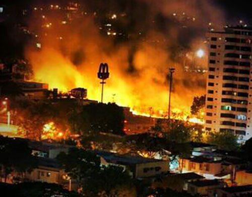 Part of the original image from February 2014 said to be of Valencia, Venezuela. Its provenance is uncertain. The earliest place it can be found is at CaracasChronicles.com.