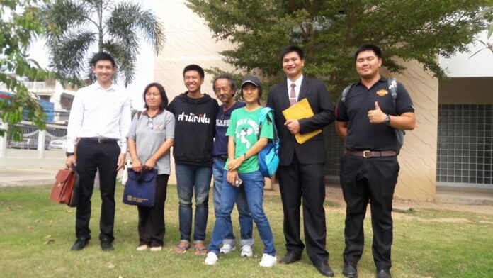 Activist Jatupat ‘Pai’ Boonpattararaksa, third from left, in a photo with family, friends and lawyer after being freed on bail. Photo: Wiboon Boonpattararaksa/ Facebook