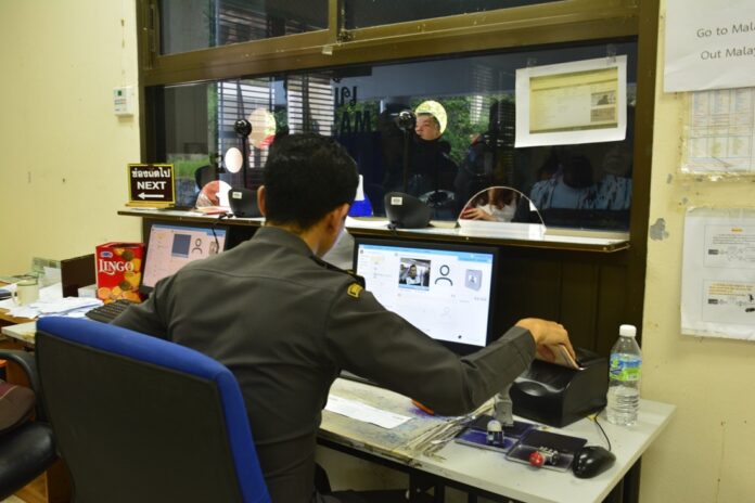 An immigration police officer at a Thai-Malaysian border checkpoint Wednesday in Yala province.