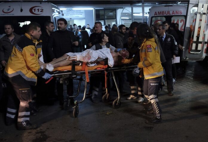Rescue and medics carry a wounded person after attacks in Istanbul, late Saturday. Photo: Cansu Alkaya / Associated Press