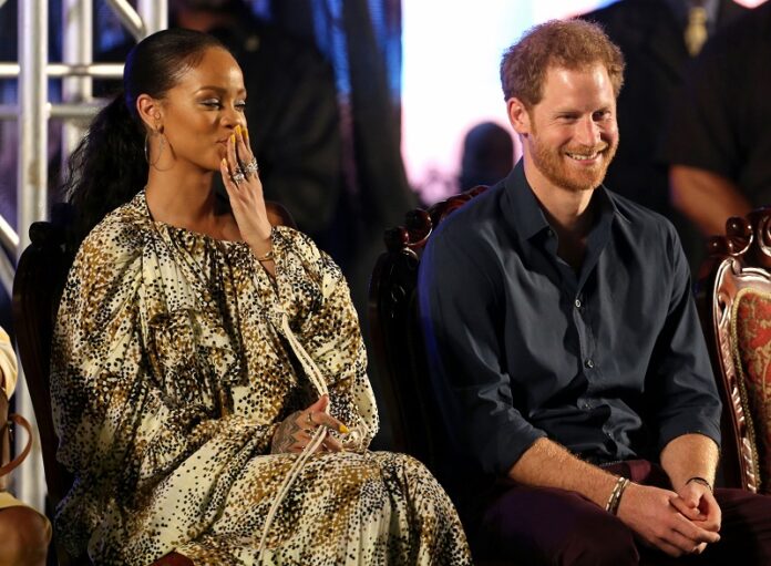 Britain's Prince Harry and Bajan singer Rihanna attend Golden anniversary celebrations Wednesday at the Kensington Oval cricket ground, marking 50 years of the island's independence from England, in Bridgetown, Barbados. Photo: Chris Radburn / Associated Press