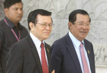 UN Researcher Calls for Cambodia to Speed up Trials Cambodia's Prime Minister Hun Sen, right, walks together with opposition Cambodia's Rescue Party Deputy President Kem Sokha, center in 2016 during a break at National Assembly in Phnom Penh, Cambodia. Photo: Heng Sinith / Associated Press