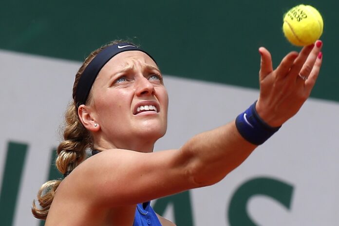 Petra Kvitova of the Czech Republic serves in her third round match of the French Open tennis tournament against Shelby Rogers of the U.S. in May at the Roland Garros stadium in Paris. Photo: Michel Euler / Associated Press