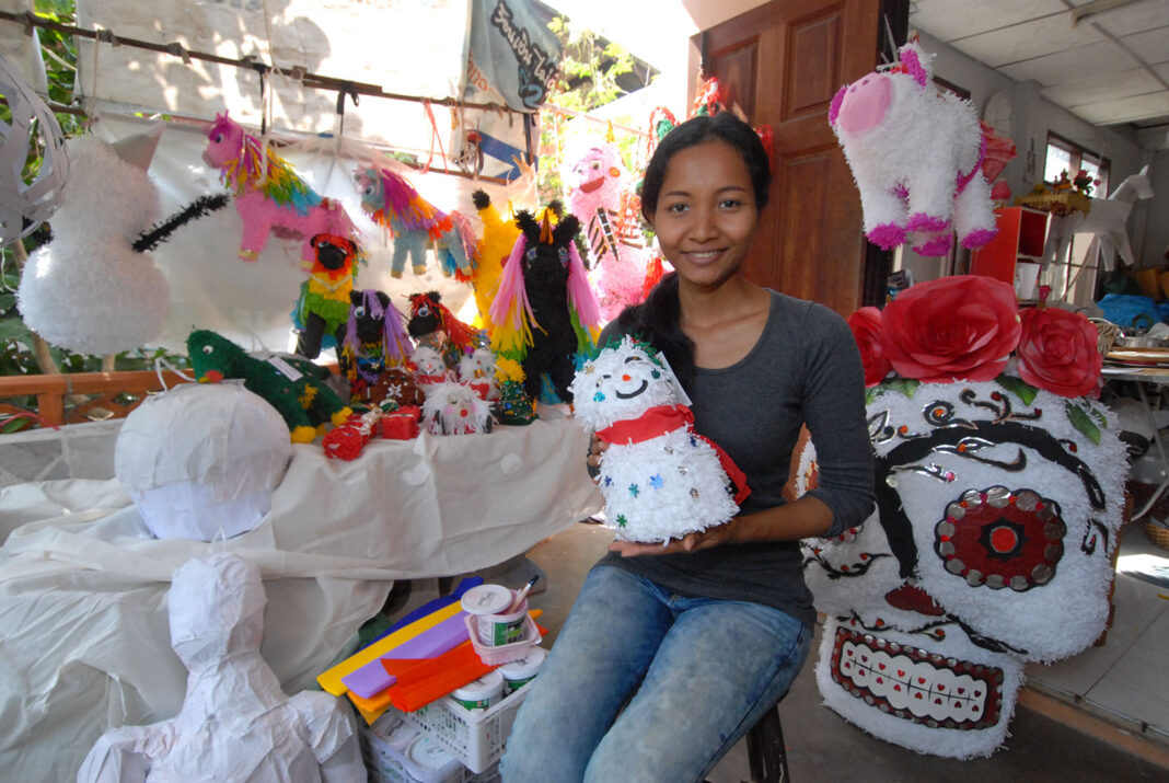 Maneeporn Puangpla with her completed and in-process piñatas at her residence in Bangkok’s Bang Khae district.