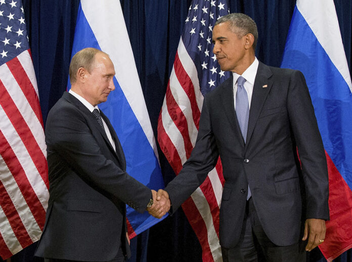 President Barack Obama shakes hands with Russian President President Vladimir Putin before a September 2015 bilateral meeting at United Nations headquarters. Photo: Andrew Harnik / Associated Press