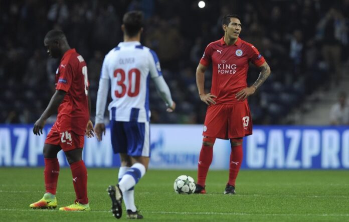 Leicester's Nampalys Mendy, left, and Jose Ulloa, right, react after Porto scored their fifth goal during a Champions League group G soccer match between FC Porto and Leicester City Wednesday at the Dragao stadium in Porto, Portugal. Photo: Paulo Duarte / Associated Press