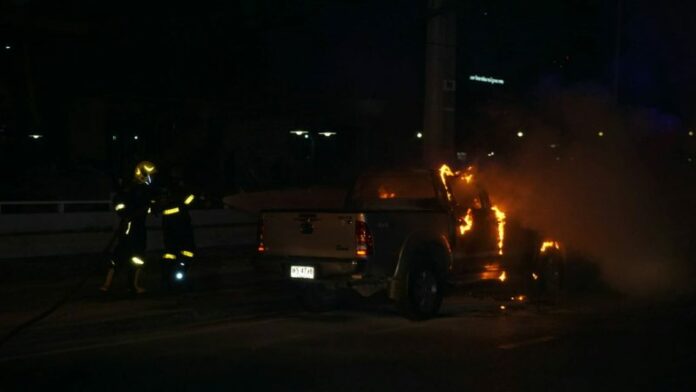 Firemen extinguishing Kitti Halita’s truck, which caught fire Wednesday evening in Bang Khen.