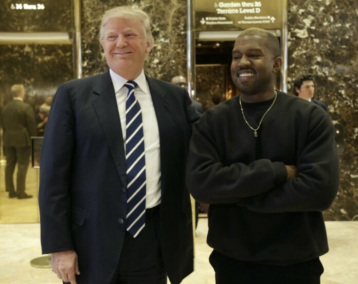 President-elect Donald Trump and Kanye West pose for a picture in the lobby of Trump Tower in New York, Dec. 13, 2016. Photo: Seth Wenig / AP.