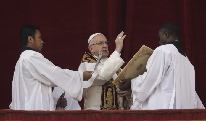 Pope Francis delivers the Urbi et Orbi (Latin for ' to the city and to the world' ) Christmas' day blessing last December from the main balcony of St. Peter's Basilica at the Vatican. Photo: Alessandra Tarantino / Associated Press