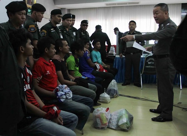 Maj. Gen. Chayapol Chatchaidej of Bangkok metro police talks to six men Tuesday accused of plotting bomb attacks in Bangkok at the office of Crime Suppression Division.