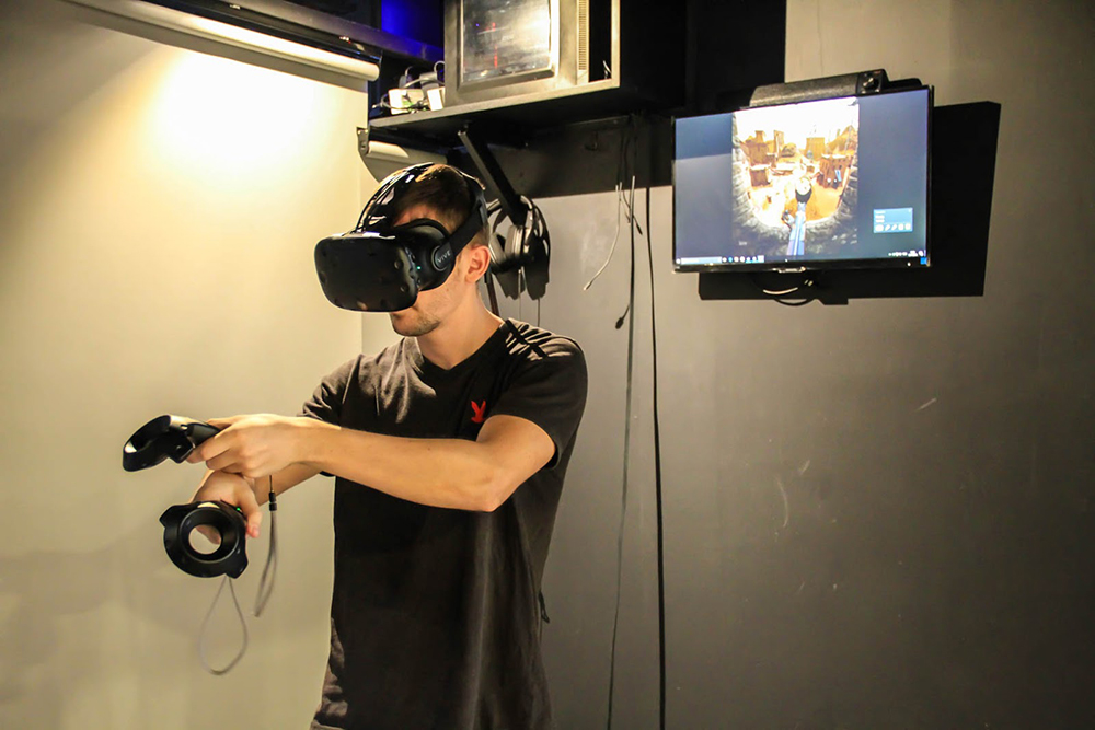 Alexandru Damascan takes aim in ‘The Nest’ at his VR gaming cafe Total VR.