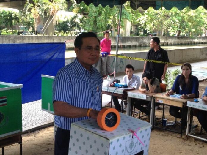 Then-army chief Prayuth Chan-ocha on March 30, 2014, casts his ballot for a Senate election in Bangkok