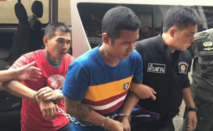 Kittikorn Wikaha, 26 and Supatchai Jansri, 25, are taken to Criminal Court Saturday morning.