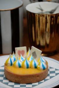The delightful Pony Poops Lemon Tart’s (160 baht) filling is the right blend of tangy and creamy, topped with whimsical multicolored striped whipped cream and white chocolate playing cards. 