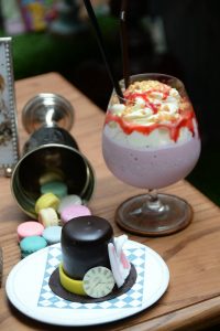 The Mad Hatter Mousse (160 baht.) is a hat-shaped, white-and-dark chocolate layered mousse topped with more chocolate, sugar rabbit ears, and a white choc clock face.