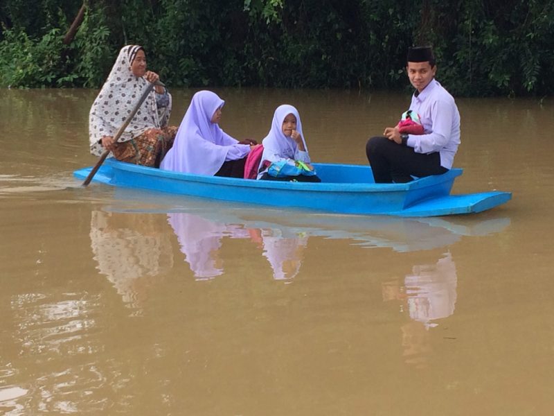 Residents aboard a boat Wednesday in Pattani province.