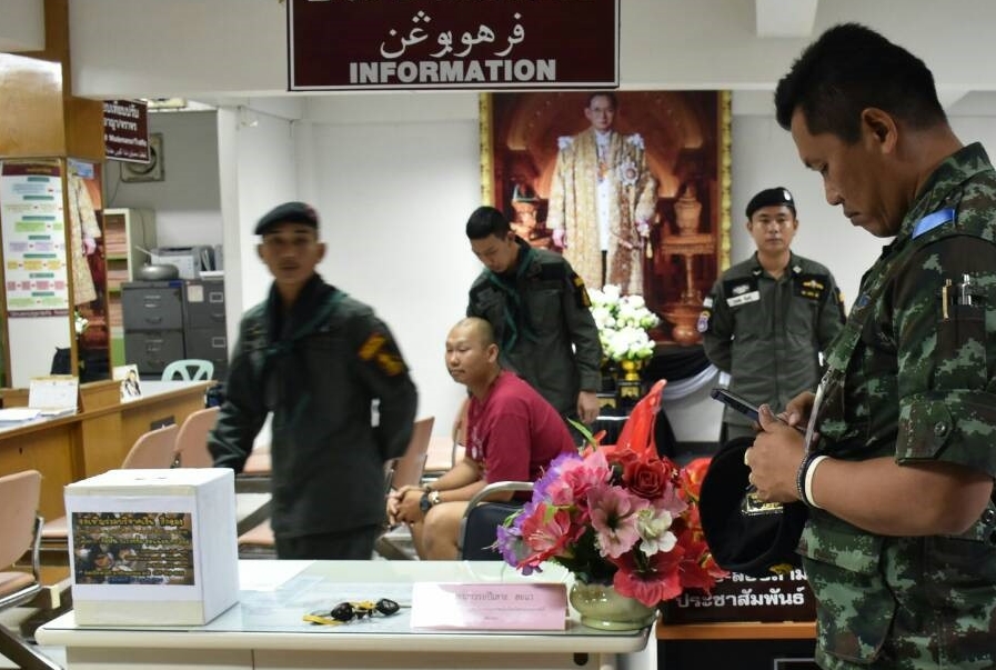 Lance Cpl. Nirand Im-Erb, in red, in custody at Yala City Police Station on Thursday