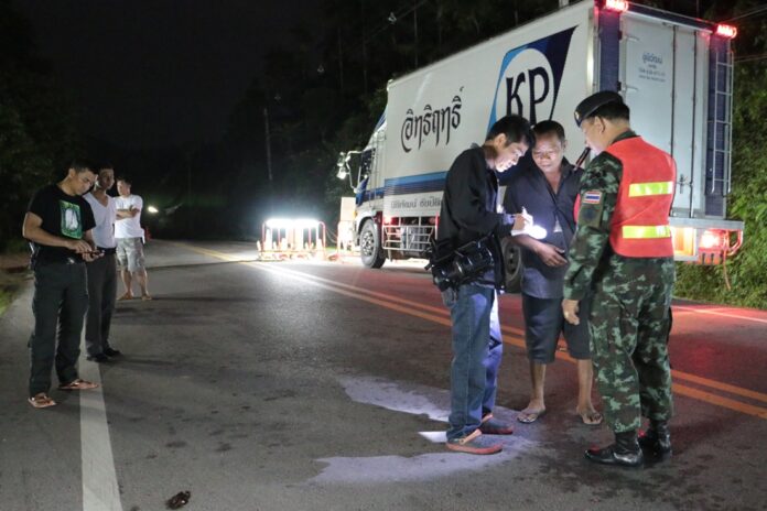 Soldiers and reporters on Wednesday night inspect the scene of an alleged heist in Phato district of Ranong province.