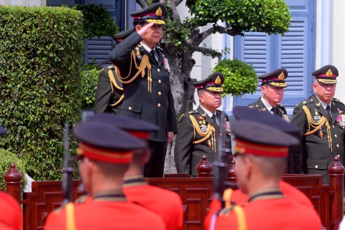 Gen. Prayuth Chan-ocha returns salute on Thursday at the headquarters of the Royal Thai Armed Forces in Bangkok.