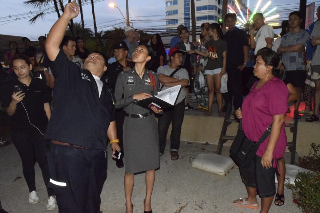 Police at the scene on Sunday where a tree branch killed a 91-year-old man in Pattaya.