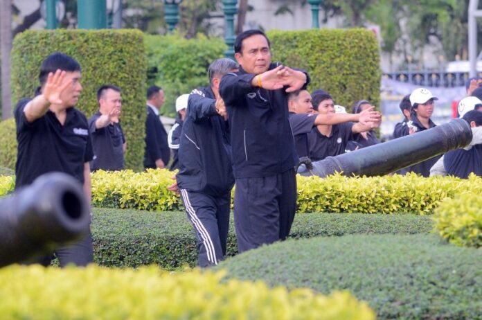 Gen. Prayuth Chan-ocha exercises Wednesday at Government House in Bangkok.