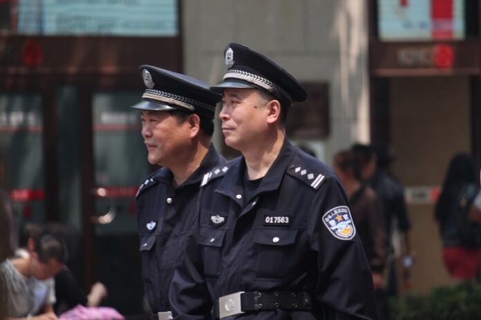 Police stand guard in 2013 in Shanghai, China. Photo: Tim Sheerman-Chase / Flickr