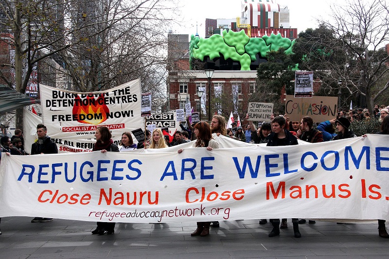 Melbourne Refugee and asylum seeker rights rally in 2013, to protest both new government proposal for assessment and resettlement of asylum seekers in Papua New Guinea, and the Liberal Party's hard line stand to use the military to turn back the boats. Photo: Takver / Flickr