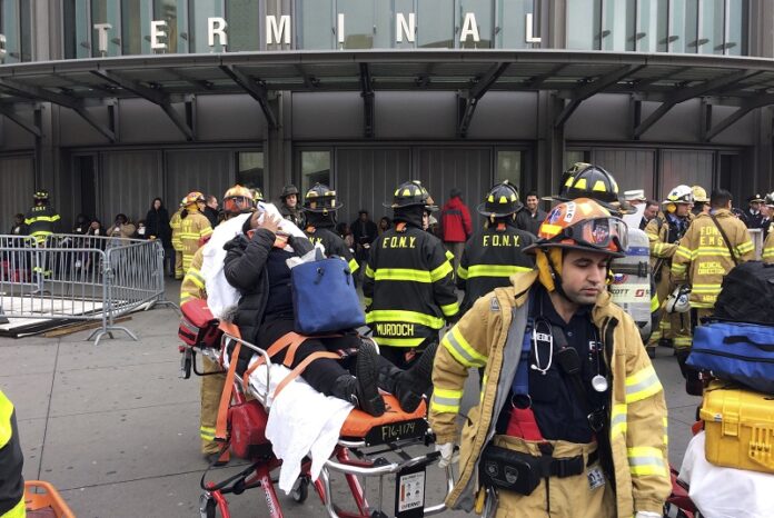 An injured passenger is taken from the Atlantic Terminal in the Brooklyn borough of New York after a Long Island Rail Road train hit a bumping block, Wednesday. Photo: Mark Lennihan / Associated Press