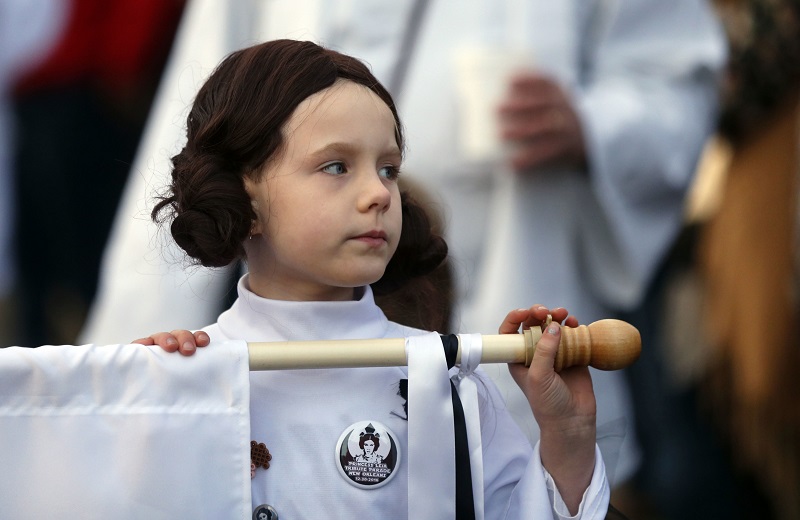 Addy Longlois, 7, dressed as Princess Leia, walks in a parade in honor of actress Carrie Fisher, who played Princess Leia in the "Star Wars" movie series, in New Orleans, Friday. Photo: Gerald Herbert / Associated Press