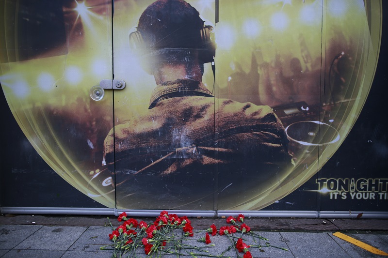 Flowers of the victims of the attack are placed outside a nightclub, which was attacked by a gunman overnight Sunday in Istanbul. Photo: Emrah Gurel / Associated Press
