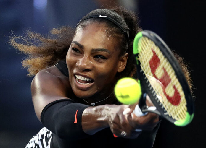 United States' Serena Williams makes a backhand return to her sister Venus during the women's singles final in January at the Australian Open tennis championships in Melbourne, Australia. Photo: Aaron Favila / Associated Press