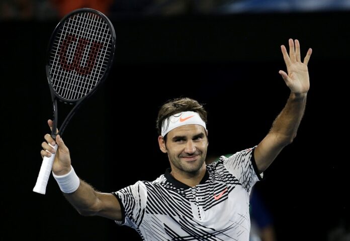 Switzerland's Roger Federer celebrates after defeating Austria's Jurgen Melzer in their first round match at the Australian Open tennis championships Monday in Melbourne, Australia. Photo: Aaron Favila / Associated Press