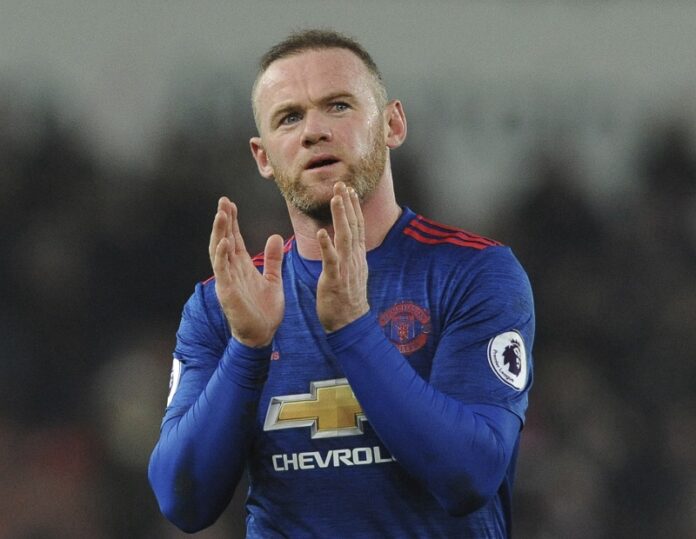 Manchester United's Wayne Rooney waves to fans after the English Premier League soccer match between Stoke City and Manchester United Saturday at the Britannia Stadium, Stoke on Trent, England. Photo: Rui Vieira / Associated Press