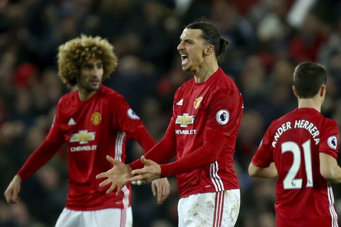 Manchester United's Zlatan Ibrahimovic, centre, celebrates scoring his side's first goal during the English Premier League soccer match between Manchester United and Liverpool Sunday at Old Trafford stadium in Manchester, England. Photo: Dave Thompson / Associated Press