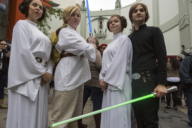 Costumed fans in honor of actress Carrie Fisher, who played Leia in the "Star Wars" movie series, gather for a memorial for actress Carrie Fisher in the forecourt at the TCL Chinese Theatre in the Hollywood section of Los Angeles, Saturday. Photo: Damian Dovarganes / Associated Press