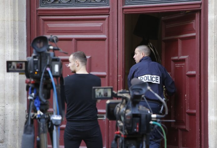 In this Oct.3, 2016 file photo, a French police officer enters the residence of Kim Kardashian West in Paris.