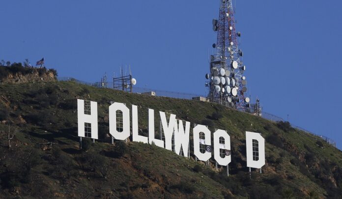 The Hollywood sign is seen vandalized Sunday. Photo: Damian Dovarganes / Associated Press