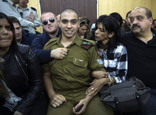 Israeli solider Sgt. Elor Azaria waits with his parents for the verdict inside the military court in Tel Aviv, Israel on Wednesday. Photo: Heidi Levine, Pool via AP