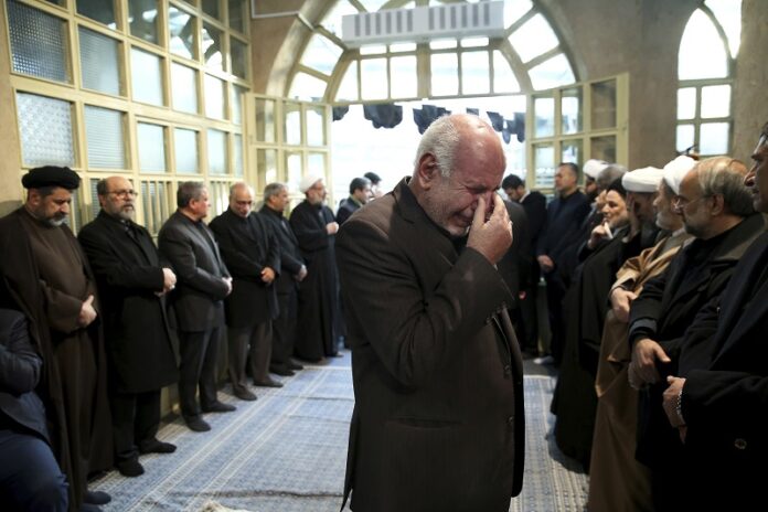 A man weeps during a mourning ceremony for former Iranian President Akbar Hashemi Rafsanjani, who died Sunday after suffering a heart attack, Monday at the Jamaran mosque in north Tehran, Iran. Photo: Ebrahim Noroozi / Associated Press