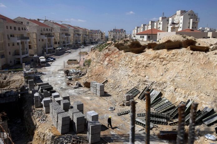 A general view of a construction site in 2011 in the West Bank Jewish settlement of Modiin Illit. B'tselem, Israel. Photo: Oded Balilty / Associated Press