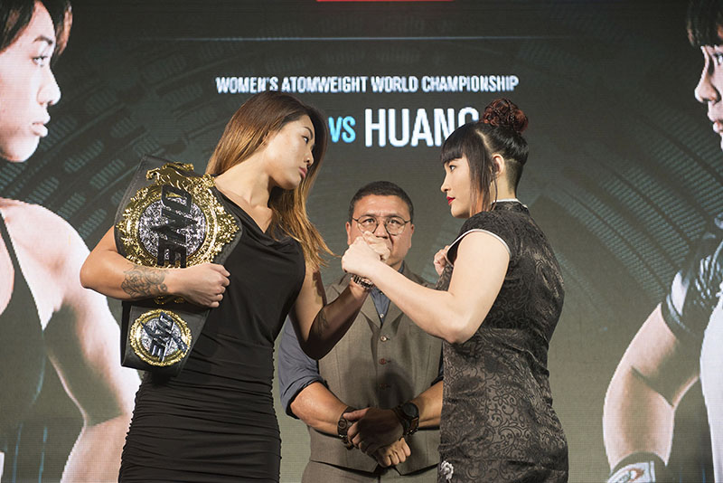Mixed martial arts One Women's Atomweight World Champion Angela Lee, left, poses with challenger Jenny Huang of Taiwan at a In Jan. 17 press conference in Bangkok. Photo: One Championship