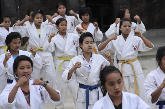 Internally displaced girls in Jeyang village camp, near the China border, join the karate training for self-defense in November in Kachin state, Myanmar. Photo: Esther Htusan / Associated Press