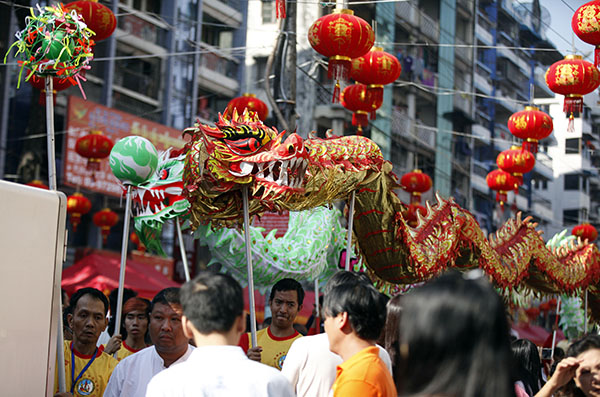 Myanmar: Local Chinese artists perform a dragon dance during cerebrations to mark Lunar New Year on Saturday in Yangon. Photo: Thein Zaw / Associated Press