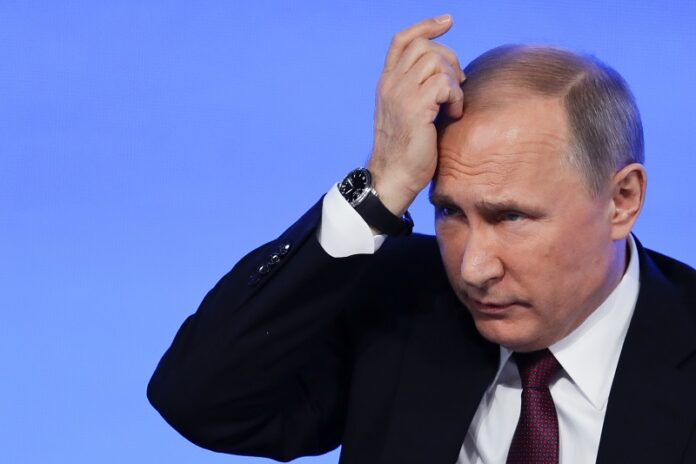 Russian President Vladimir Putin gestures during his annual news conference Dec. 23 in Moscow. Photo: Pavel Golovkin / Associated Press