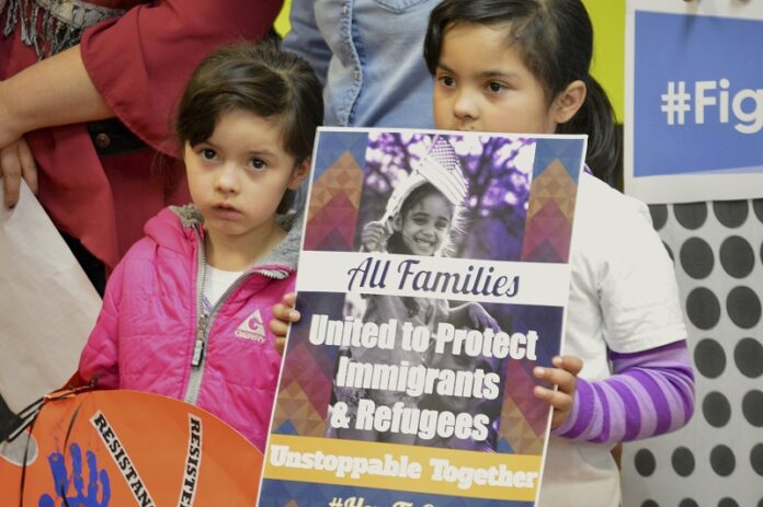 Jocelynn Lujan, 6, left, and her sister, Jennifer, 8, attend a news conference Wednesday in Albuquerque, New Mexico. Photo: Russell Contreras / Associated Press