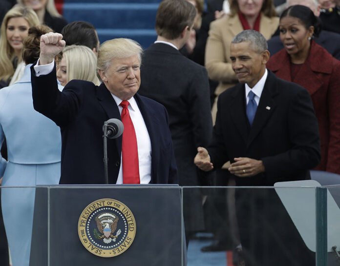President Donald Trump gestures after being sworn in as the 45th president of the United States during the 58th Presidential Inauguration on Friday at the U.S. Capitol in Washington, D.C. Photo: Patrick Semansky / Associated Press